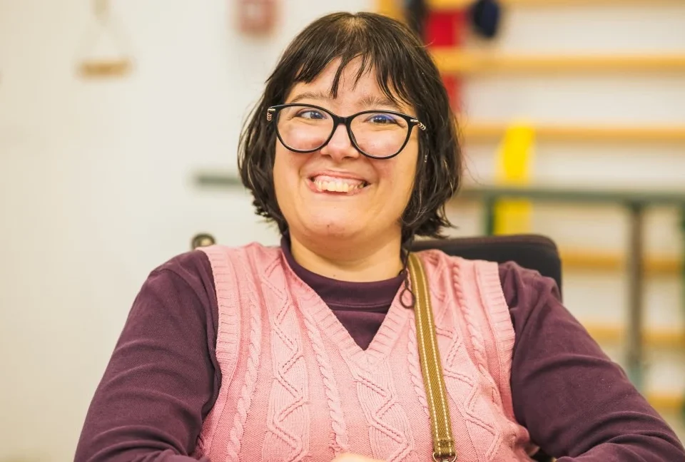Disabled woman smiling happily at camera